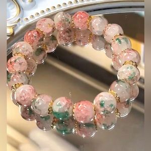 Beautiful floral peach pink toned beaded bracelet